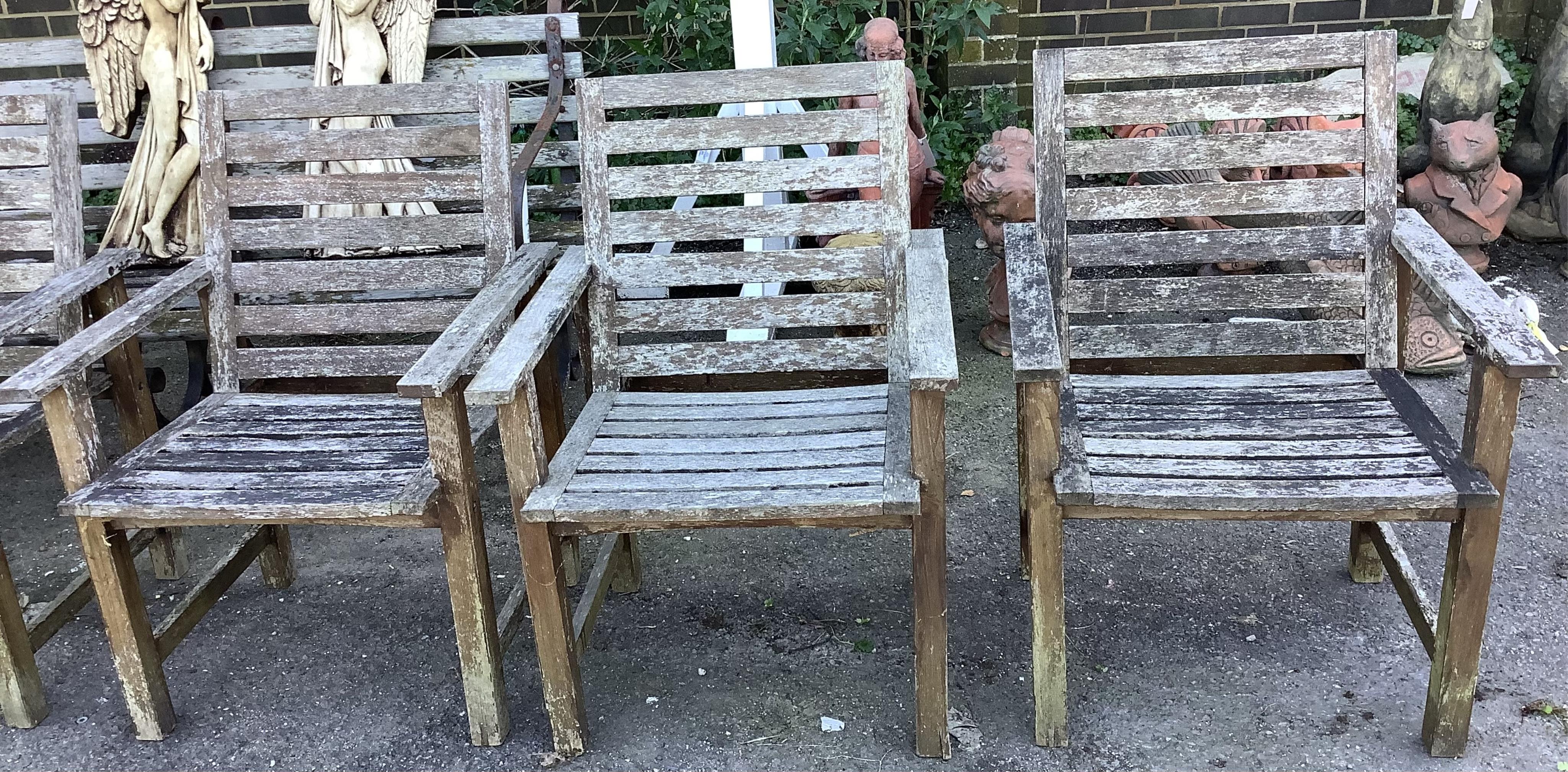 A rectangular weathered teak extending garden table, width 240cm extended, depth 100cm, height 74cm together with six weathered teak garden chairs. Condition - fair, table leaf has large chip